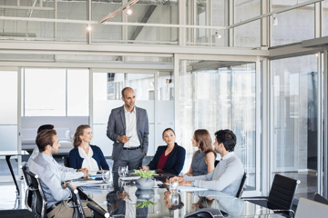 A group of business people partners during a set team meeting in the modern office.