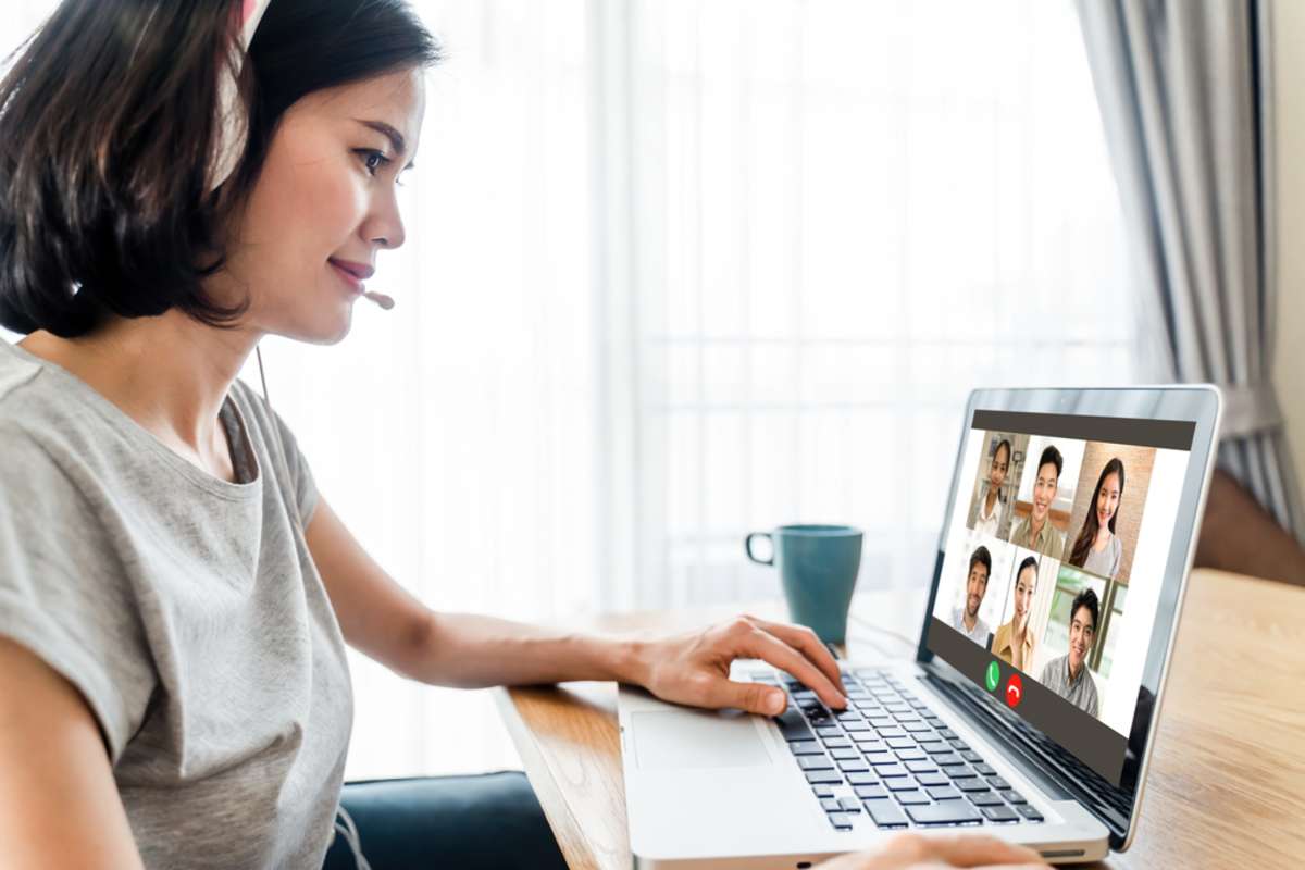 Asian business woman talking to colleague team about plan in video conference
