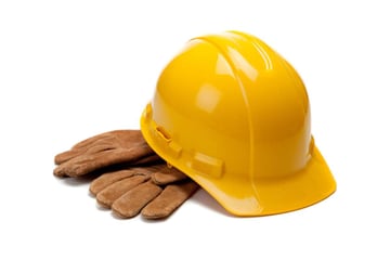 A hard hat and gloves, what is a maintenance coordinator concept
