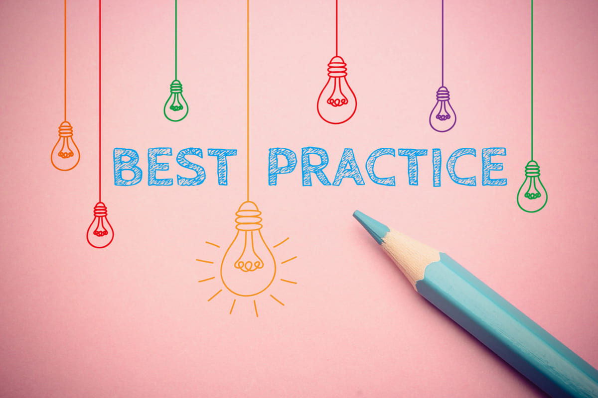 A pink background with the word best practice on it and light bulbs