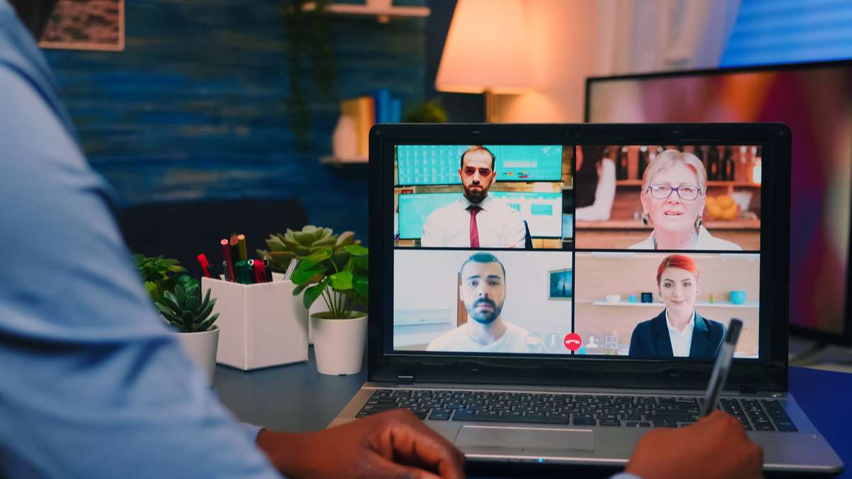 African american employee discussing during video meeting