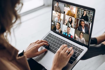 A person on a video call with a virtual team. 