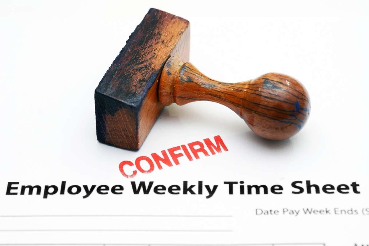 Employee time sheet with "confirm" stamp, virtual assistant time tracking concept. 