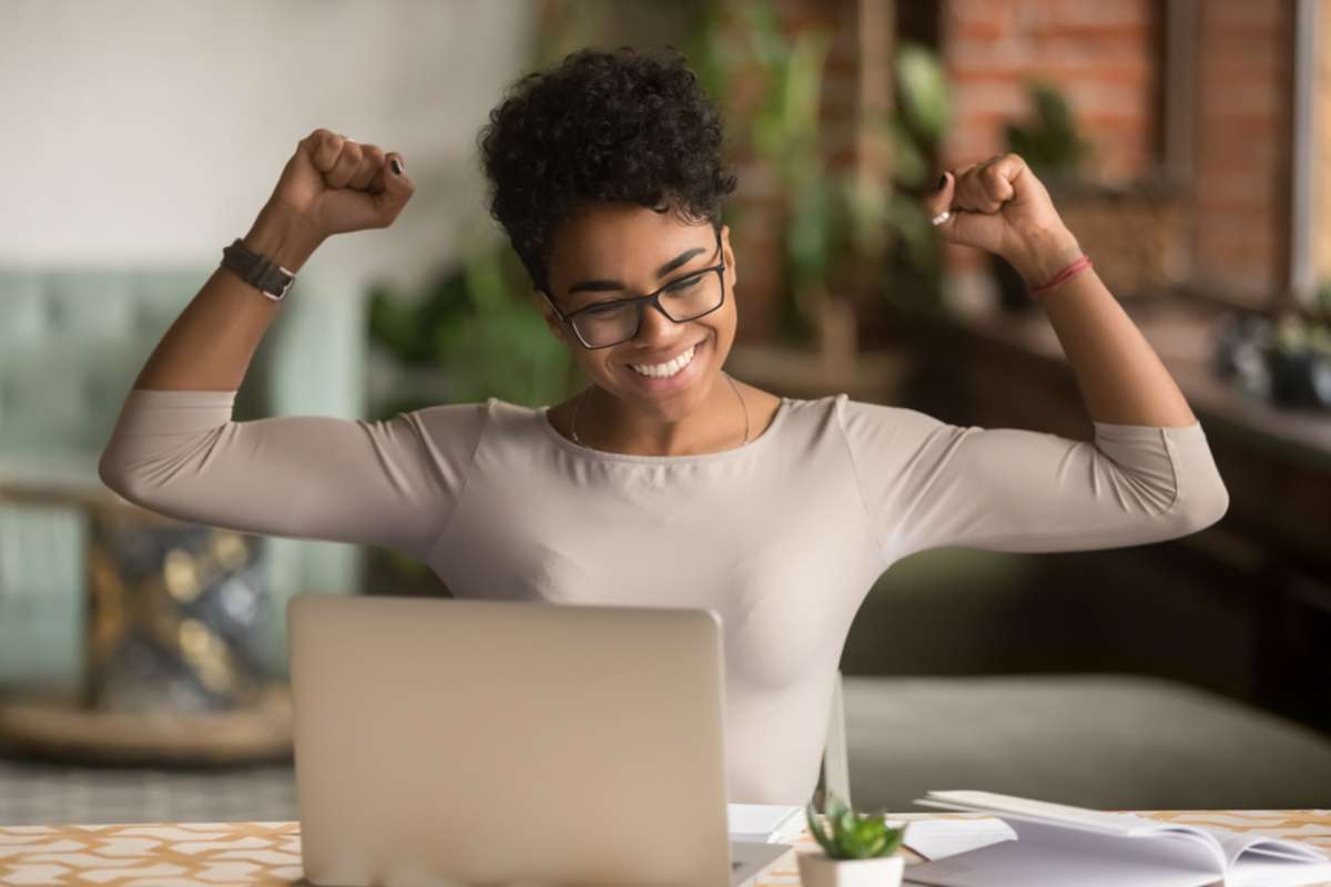 Excited happy african american woman feeling winner rejoicing online win got new job opportunity