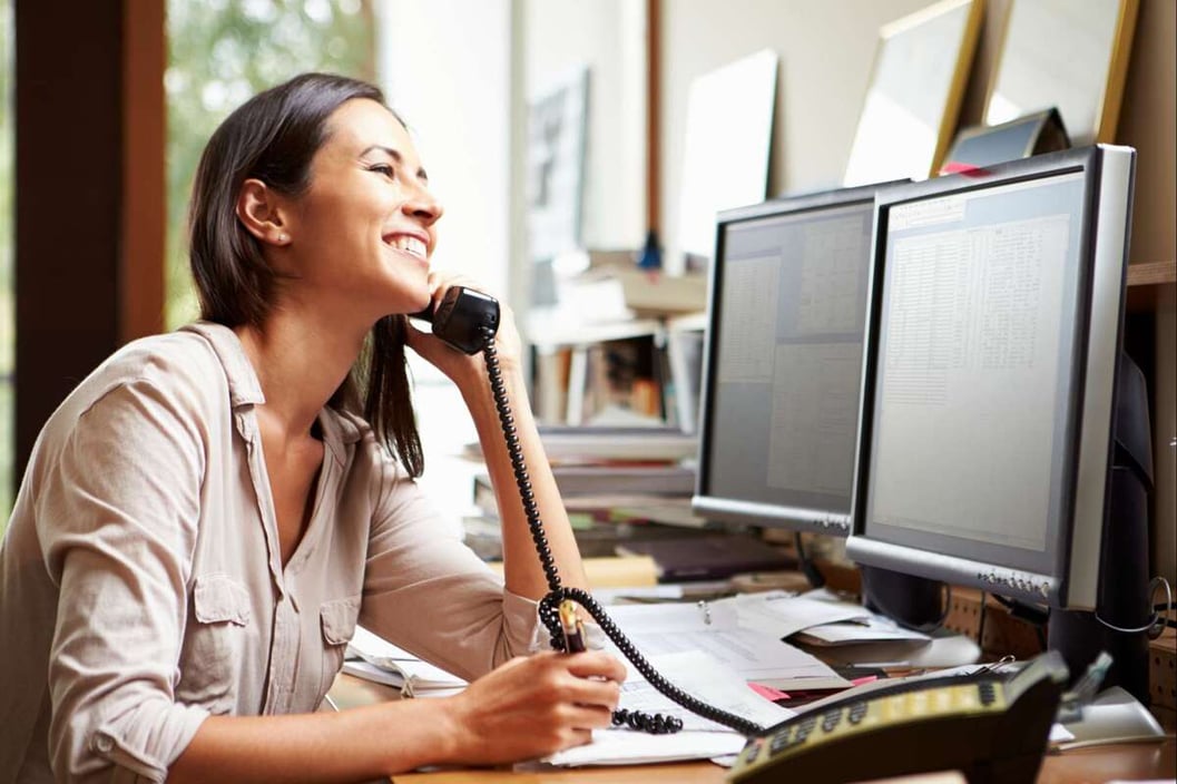 Female Architect Working At Desk On Computer