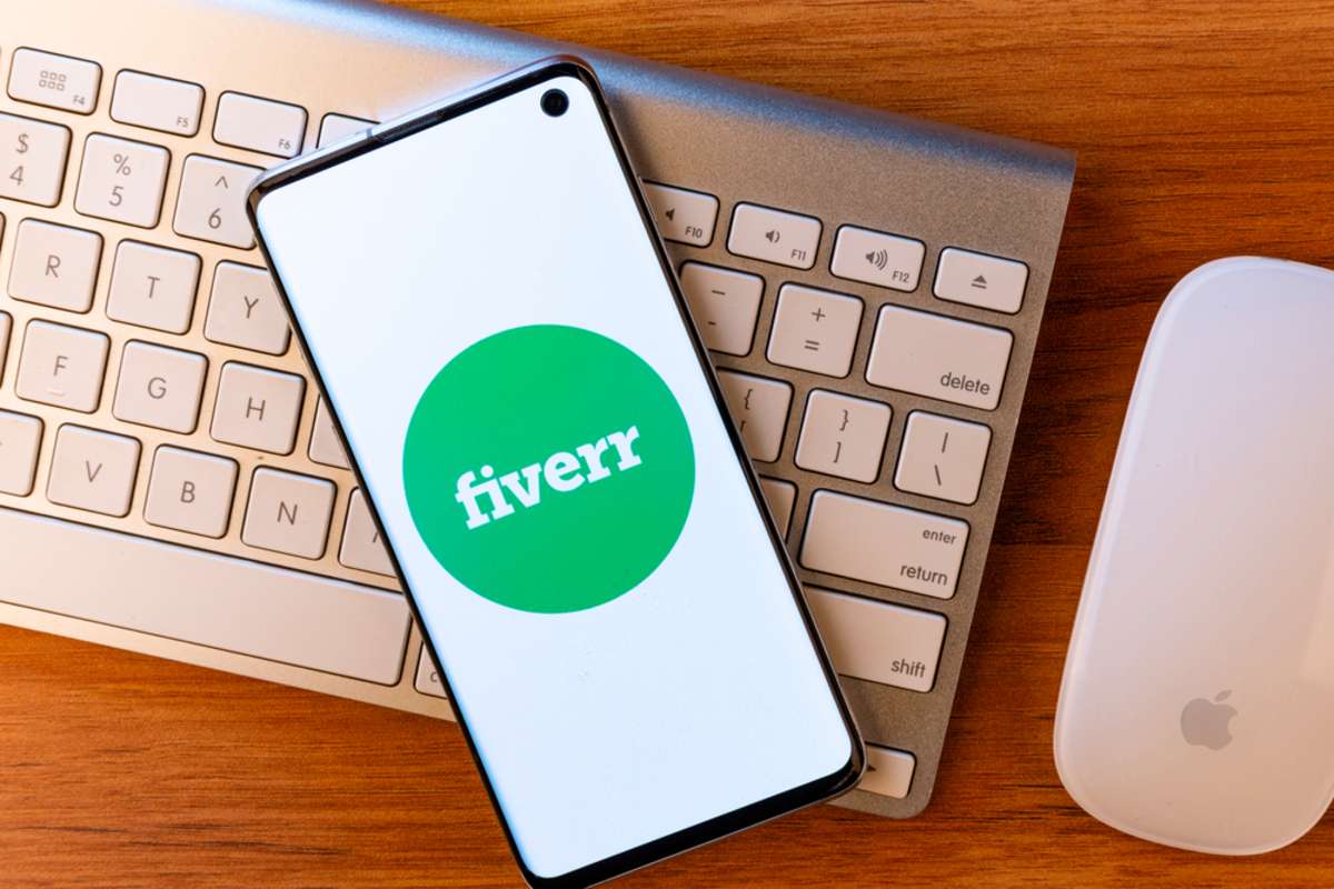 Fiverr app on a smartphone, remote virtual assistant jobs concept