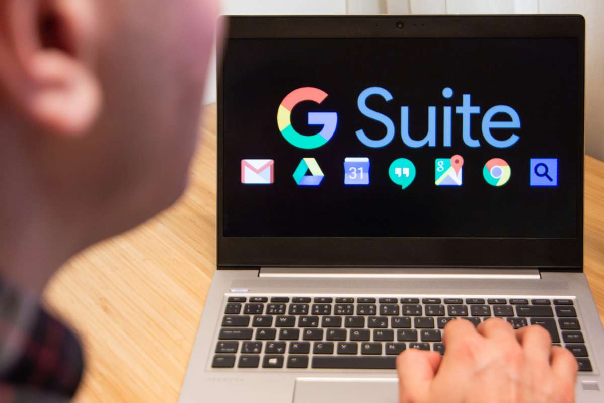 G Suite is used by a man on the laptop. Microsoft customer used computer software