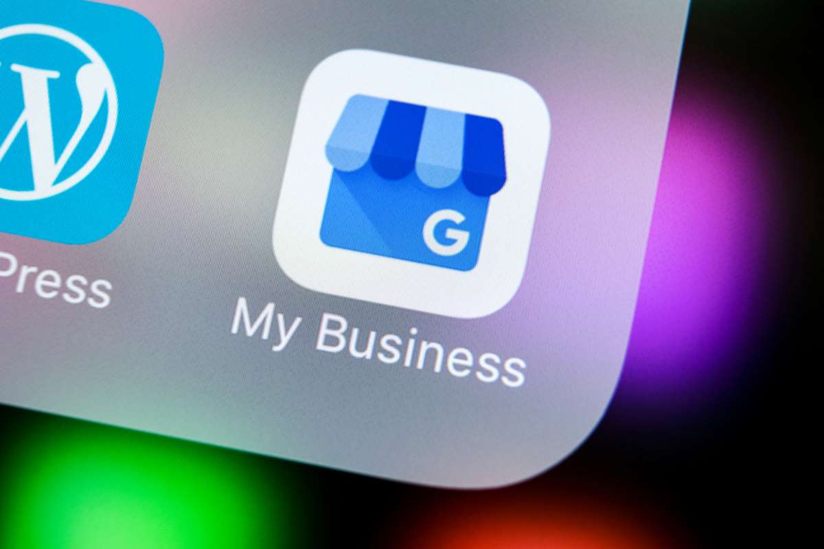 Google My Business application icon on Apple iPhone X screen close-up