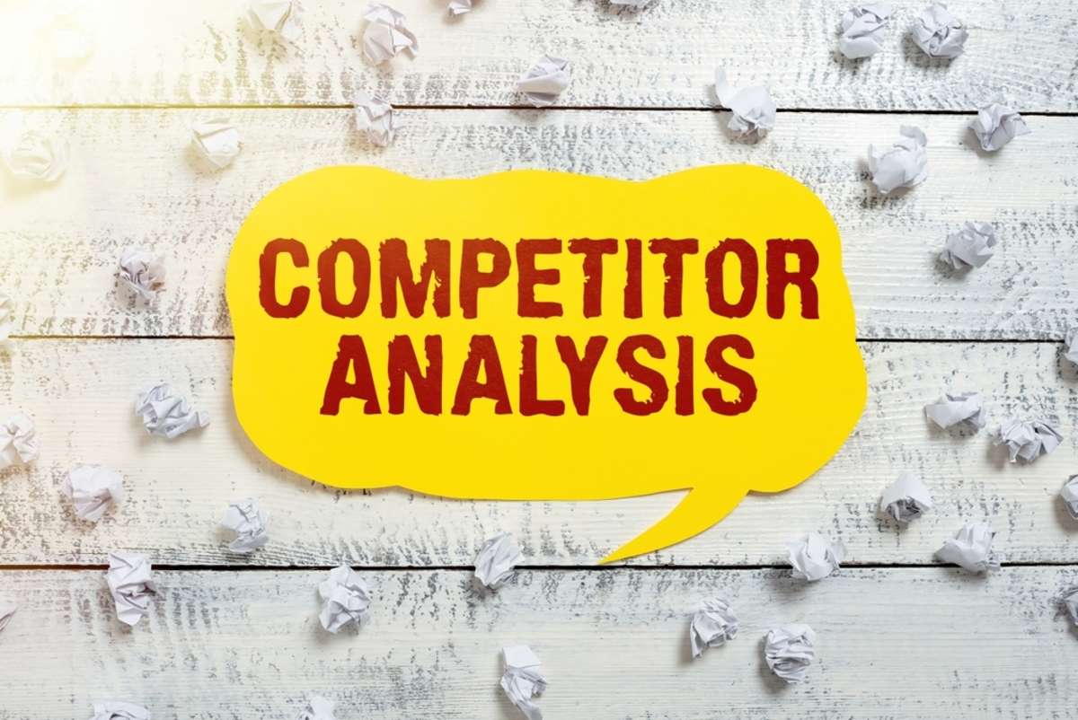 Hand writing sign Competitor AnalysisDetermine the Strength Weakness of Competitive Market