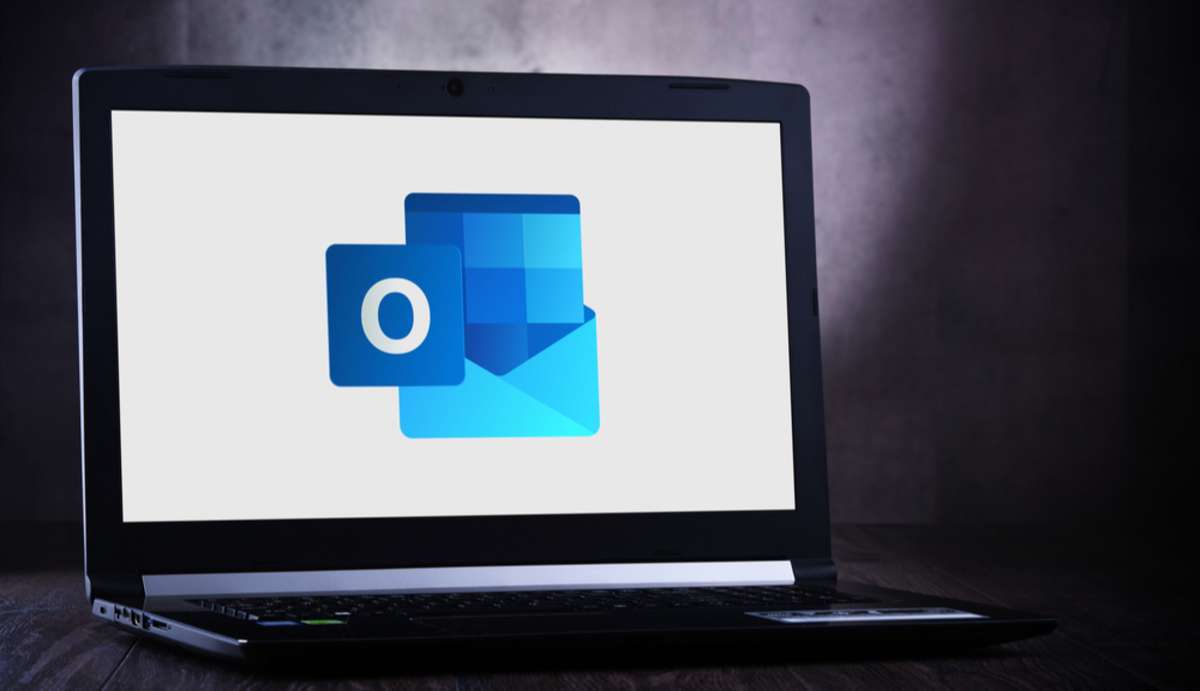 Laptop computer displaying logo of Microsoft Outlook program