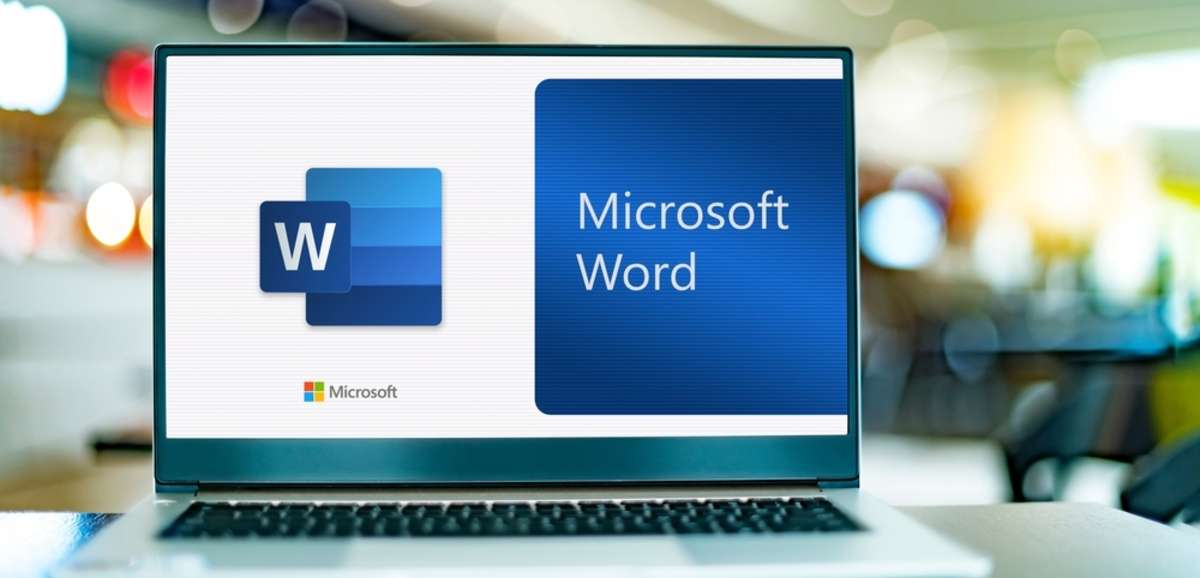 Laptop computer displaying logo of Microsoft Word-1