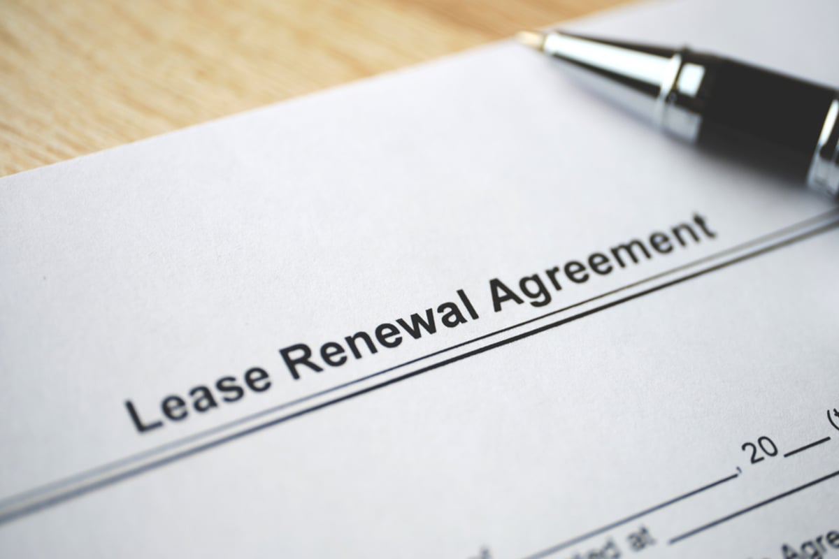 Legal document Lease Renewal Agreement on paper close up