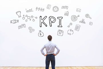 Man looking at KPI drawing, property management virtual assistant success concept