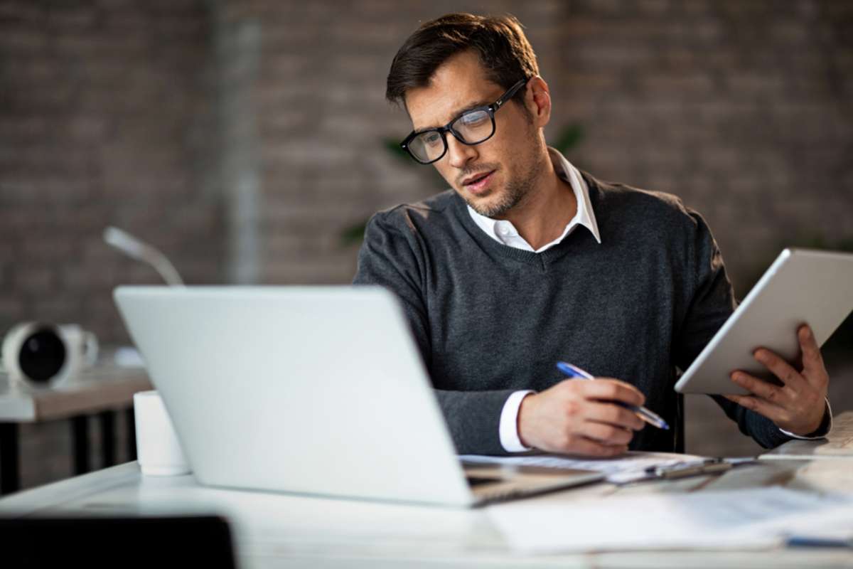 Multi-tasking businessman working in the office