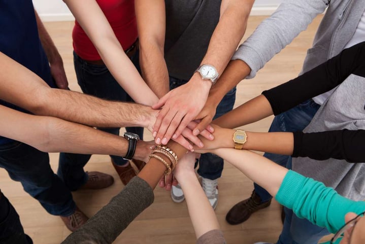 Multiethnic College Students Stacking Hands