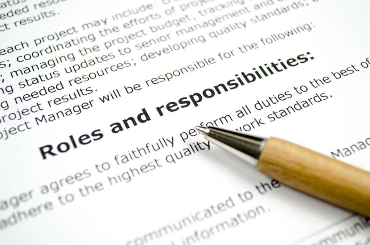 Roles and responsibilities with wooden pen