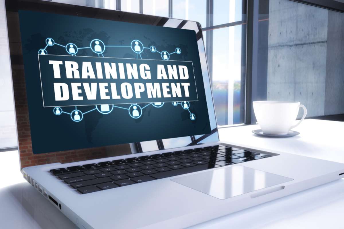 Training and Development text on modern laptop screen in office environment