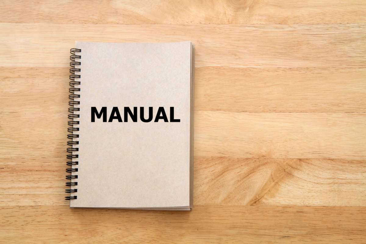 User manual or Instruction manual book on wooden desk