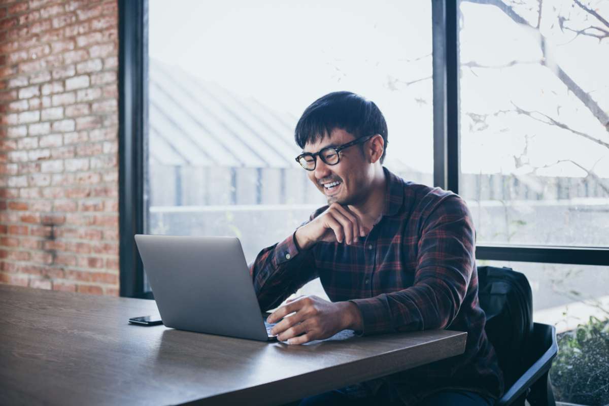 asian man work using computer hand typing laptop keyboard contact us-1