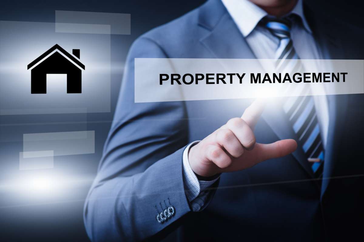 business, technology, internet, and networking concept - businessman pressing property management button on virtual screens