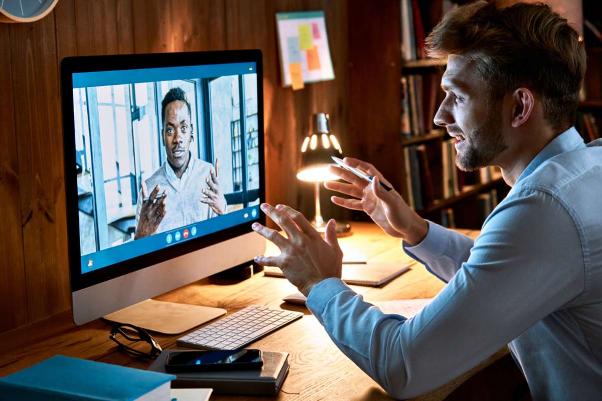 A person having a virtual meeting on a computer screen, virtual property management assistant concept. 