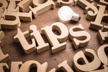 Tips spelled in wooden letters, tips for finding the ideal remote team member concept. 