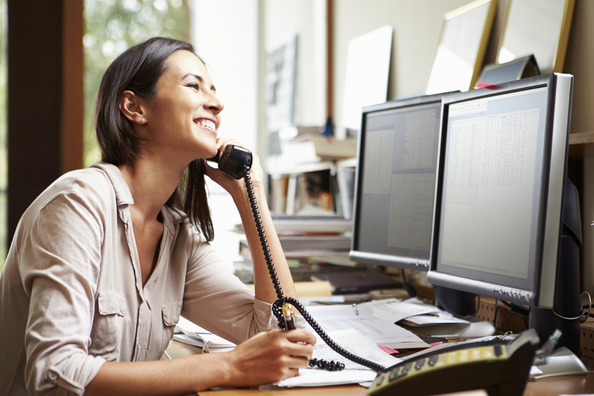 Female Architect Working At Desk On Computer-1